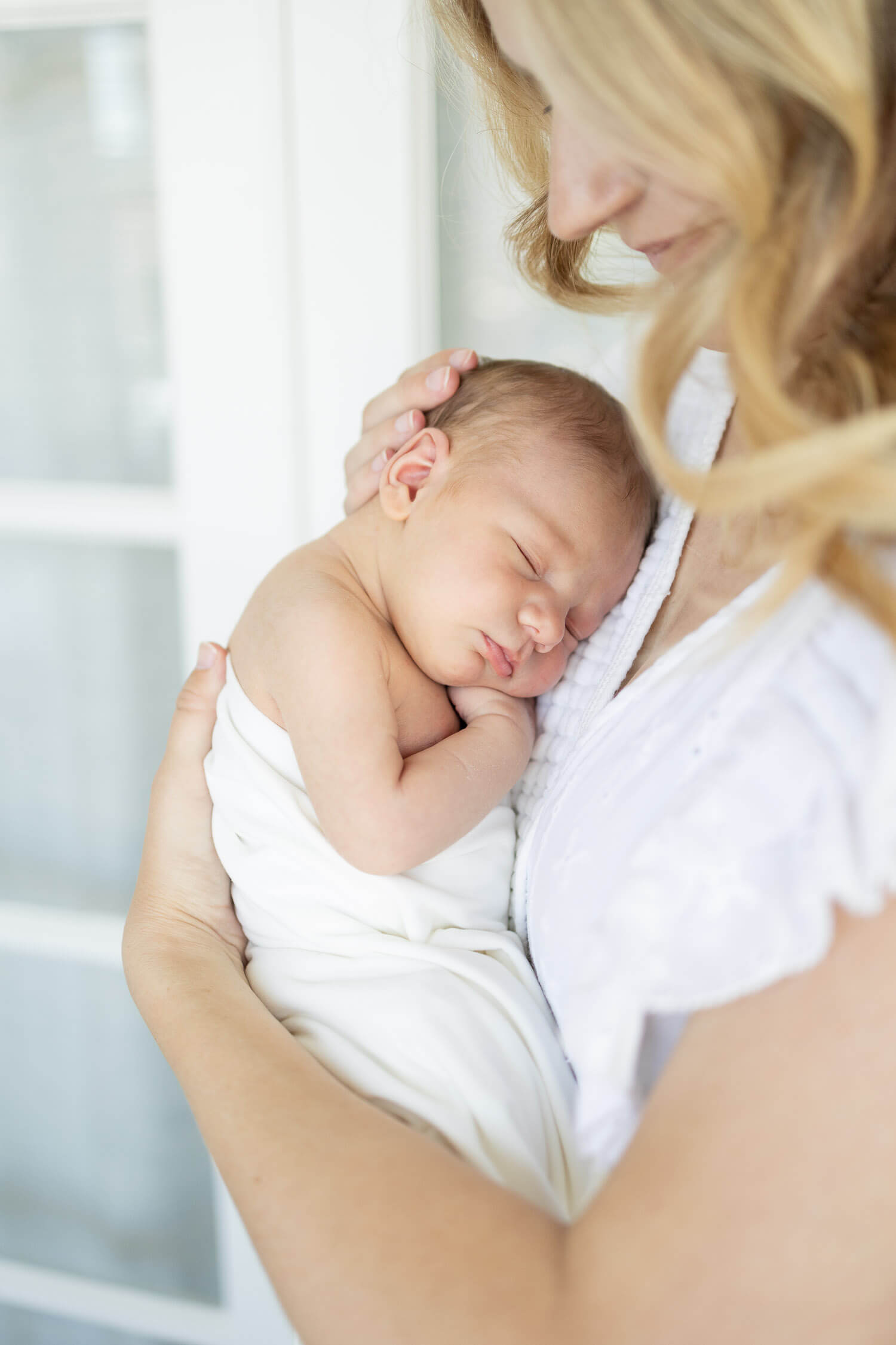 mother holding sleeping child