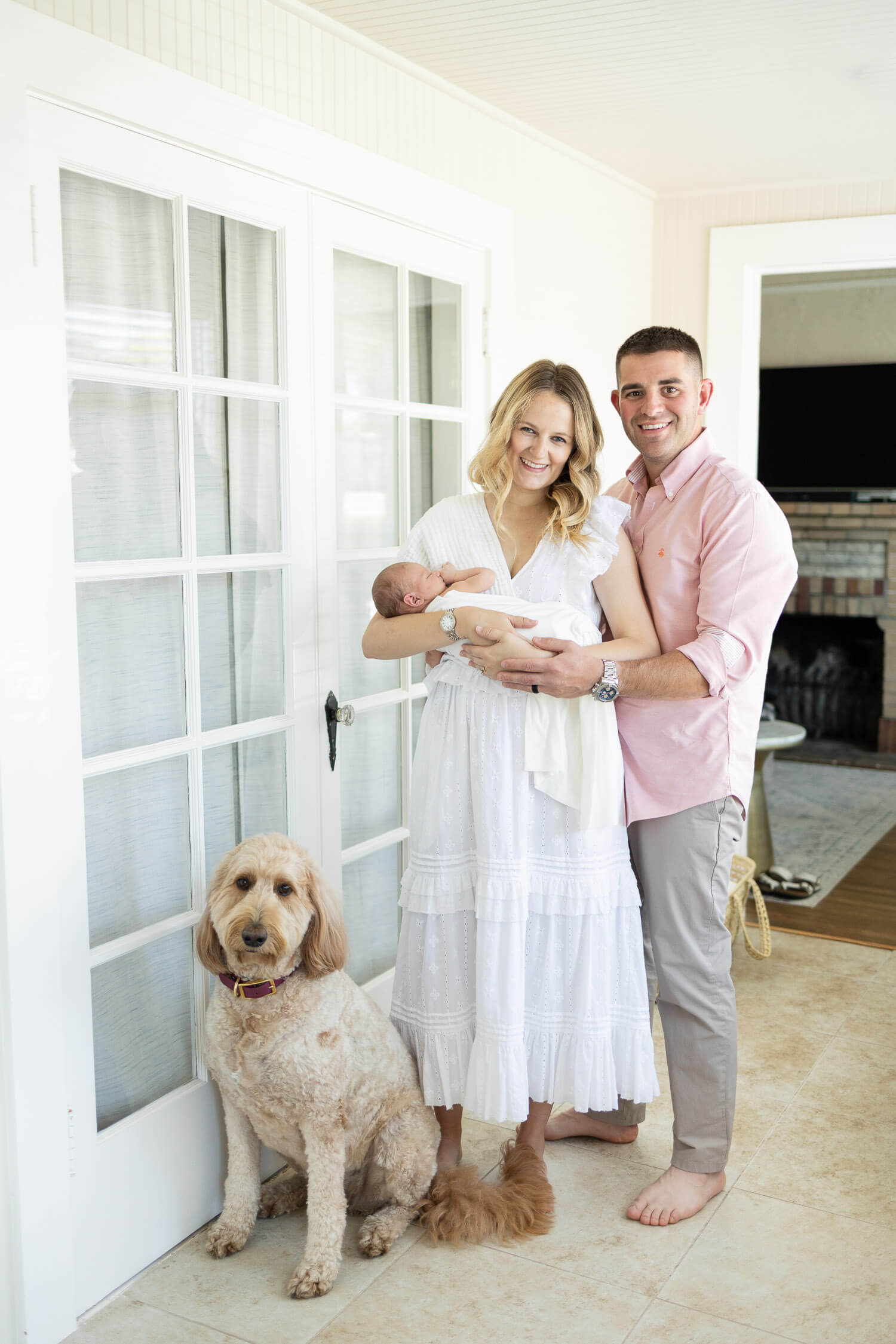 family photo with newborn and dog